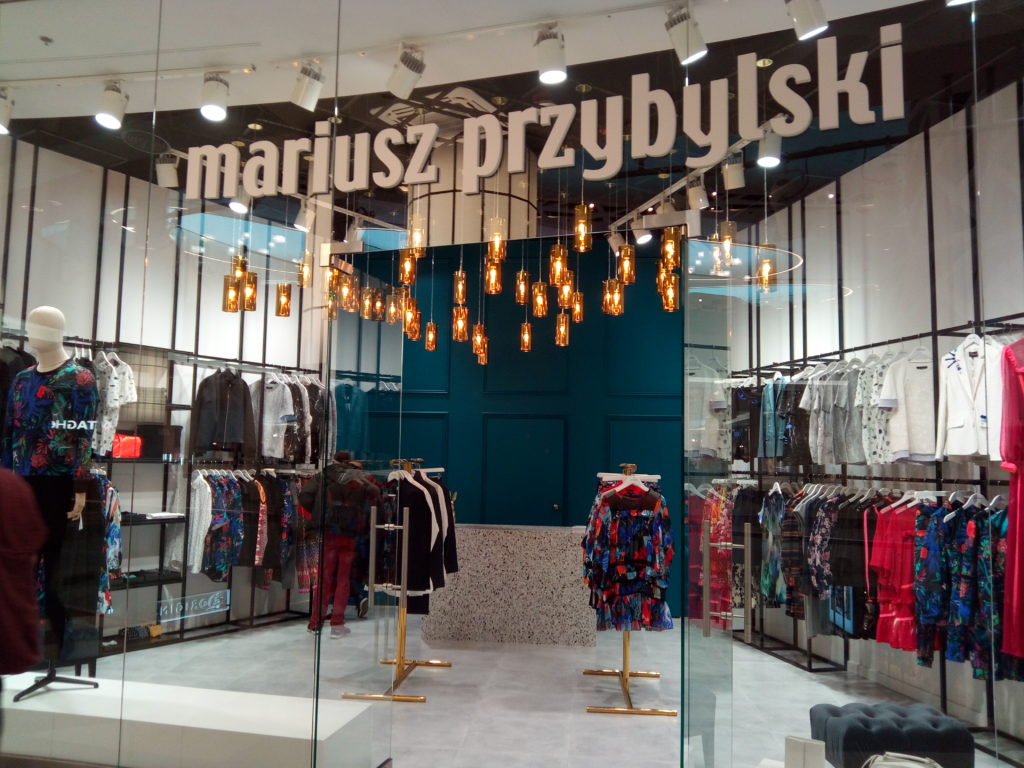 clusters of amber lights in fashion boutique mariusz przybylski