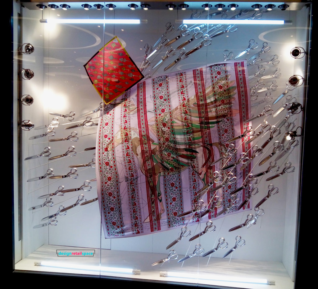 hermes window display floating tailor's shears and needles