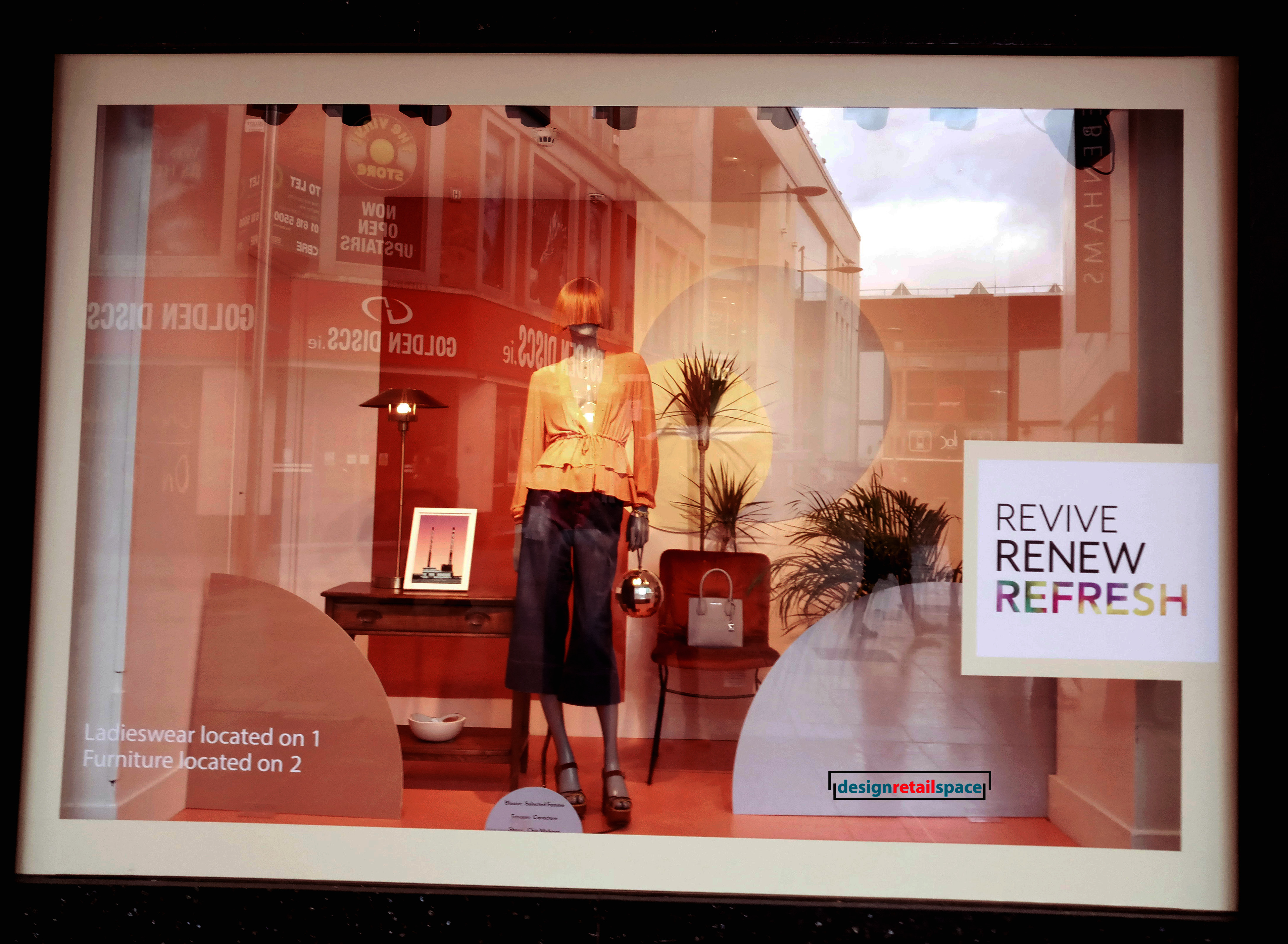 Arnotts window display showing furniture on display with Millennial pink and burgundy colour in the background as representation of colour trends 2018