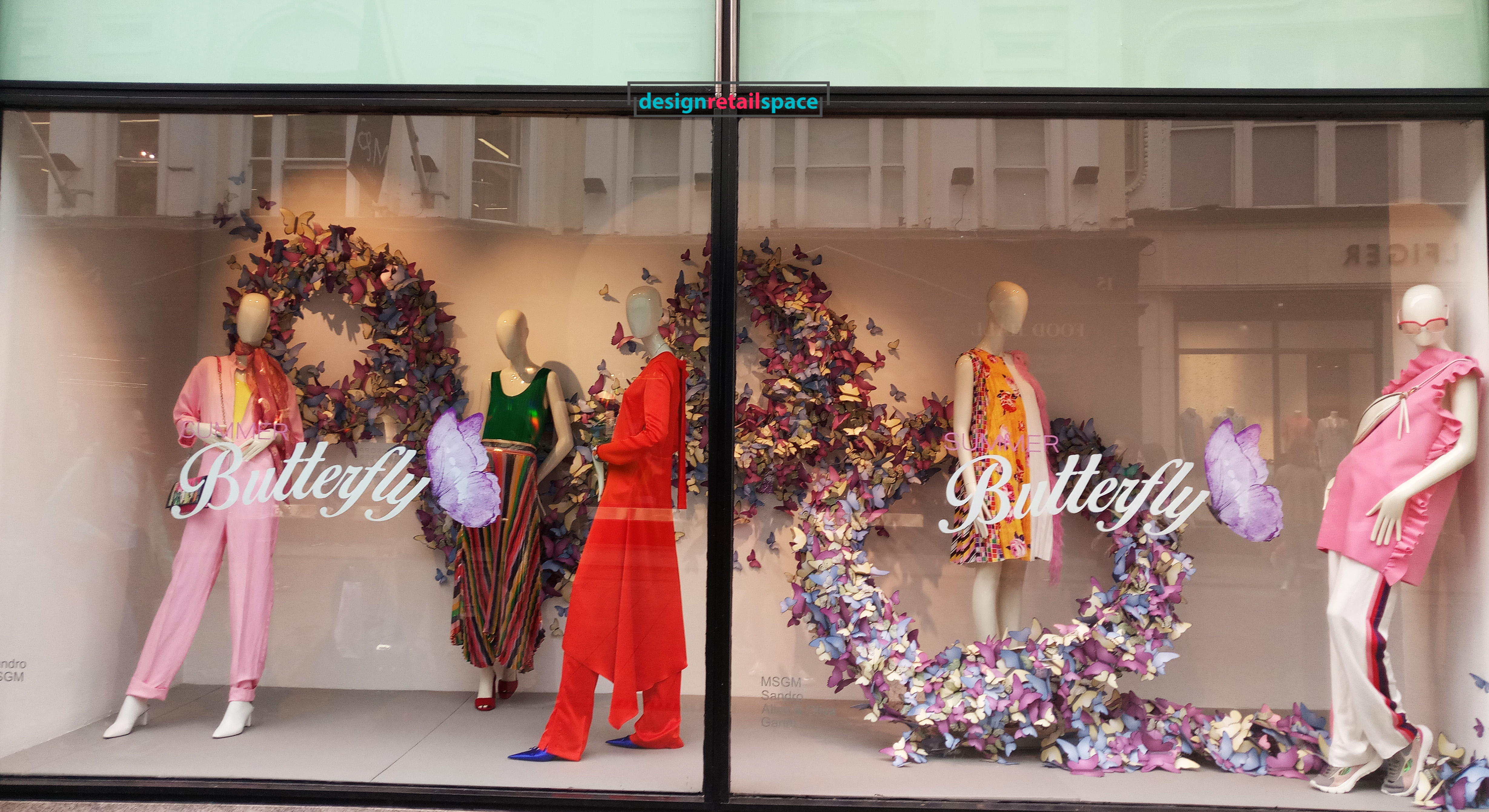 Brown Thomas window display showing lavender garlands of flowers formed in a horizontal ribbon representing colour trends 2018