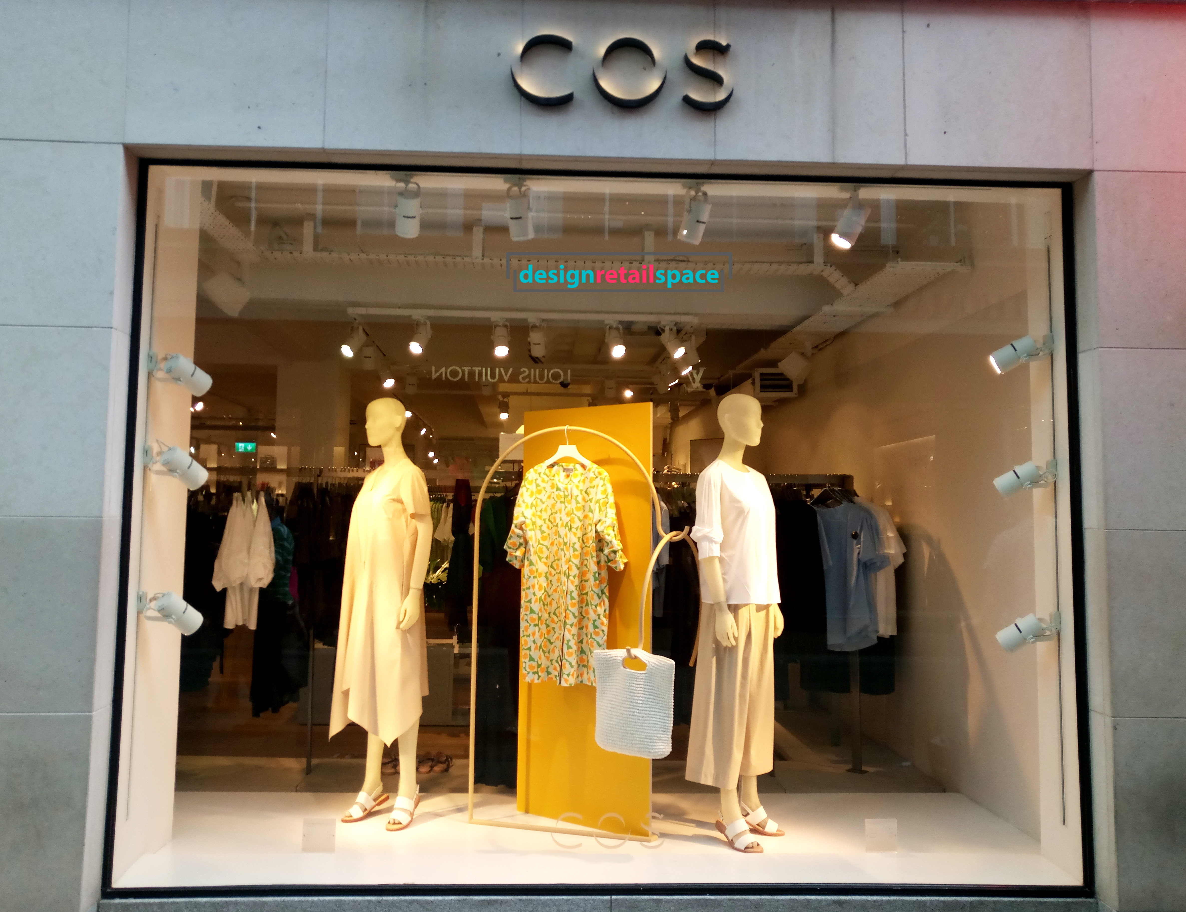 COS fashion shop with yellow known as Gen Z yellow accent on the window display