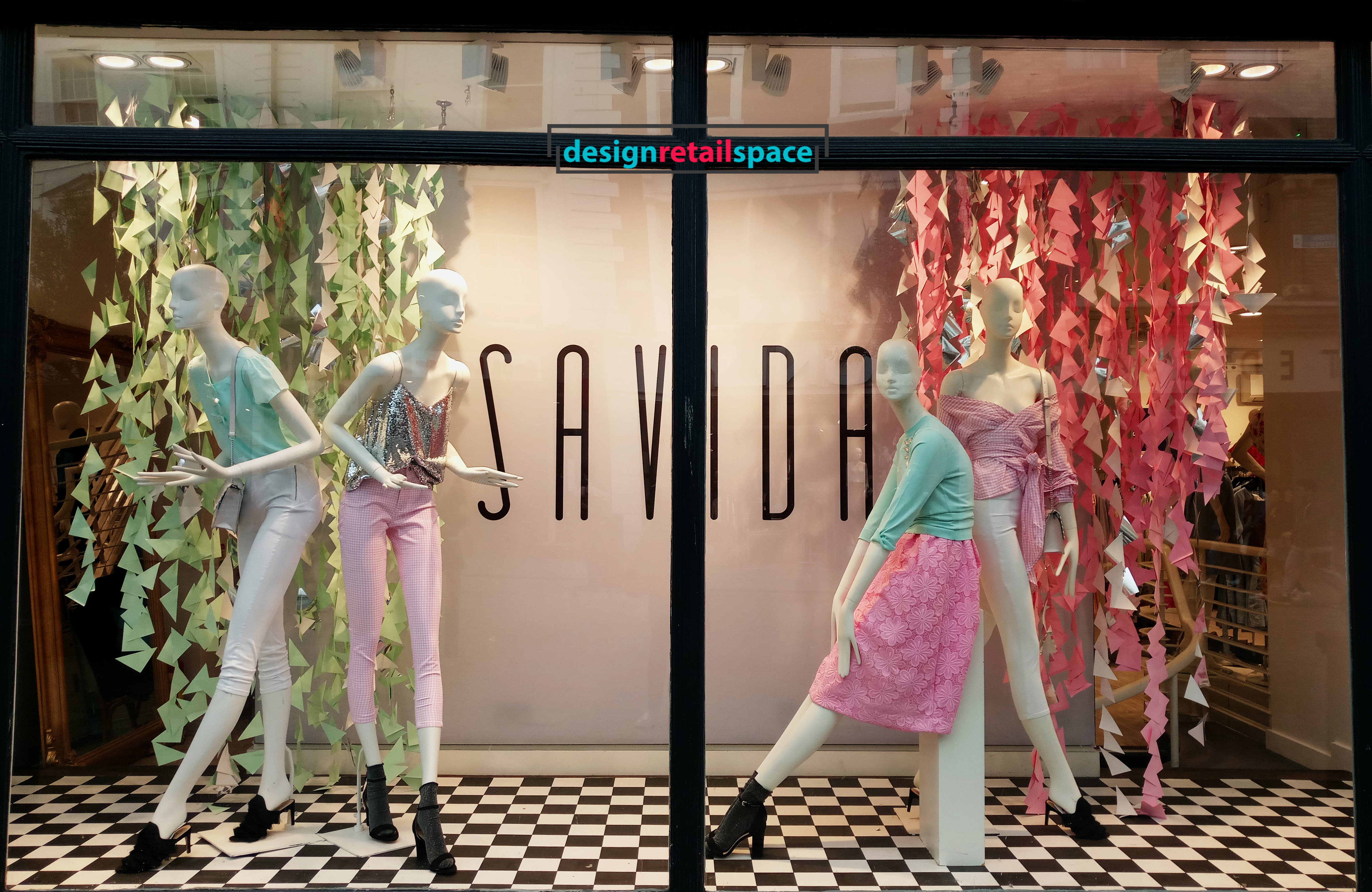 Dunnes Stores window display showing garland of flowers in pastel mint and pink colours representing colour trends 2018