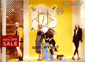 River Island window display showing yellow background with pop-art motifs as representation of Gen Z yellow and colour trends 2018