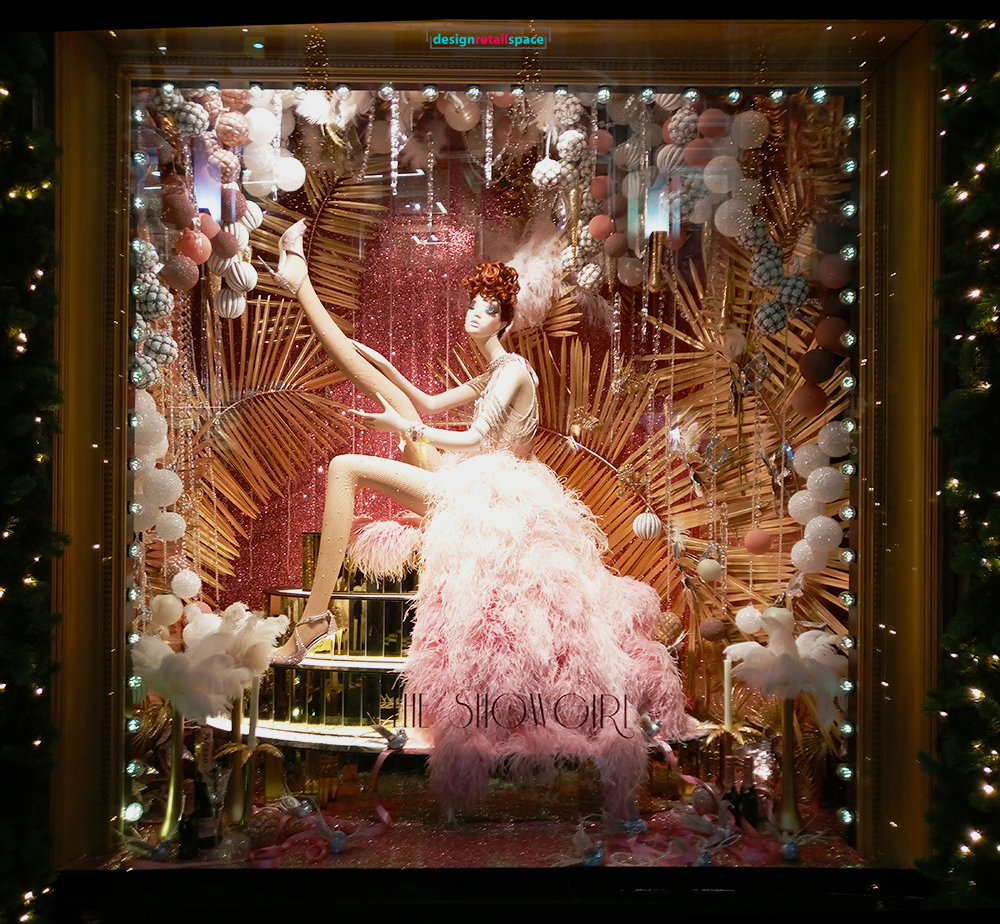 Brown Thomas Dublin Christmas 2018 window display with woman in a pink dress showing her leg