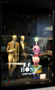 Hugo Boss window display with pink pigs by Jeremyville