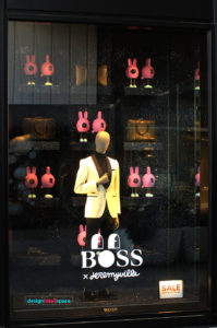 Hugo Boss window display with pink pigs by Jeremyville