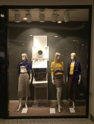 Marc Cain fashion window display with polaroid camera